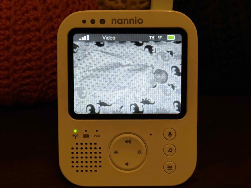 Nannio HERO3 baby monitor with image of baby in crib during the night (low light)