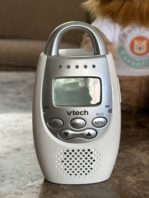 VTech DM221 Baby Monitor Parent Unit front view with buttons, screen, and light indicator