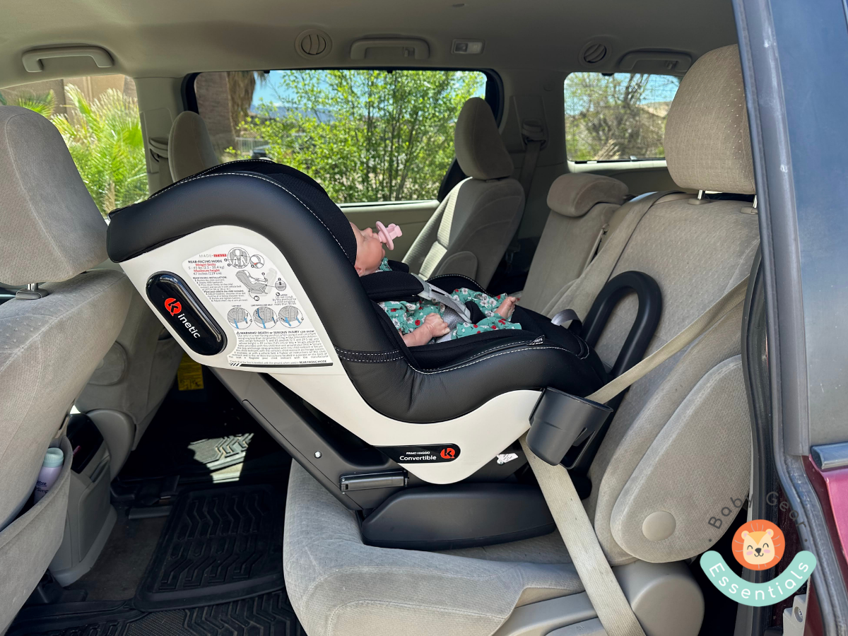 Peg Perego Primo Viaggio Convertible Kinetic installed rear-facing in the car with a baby in it