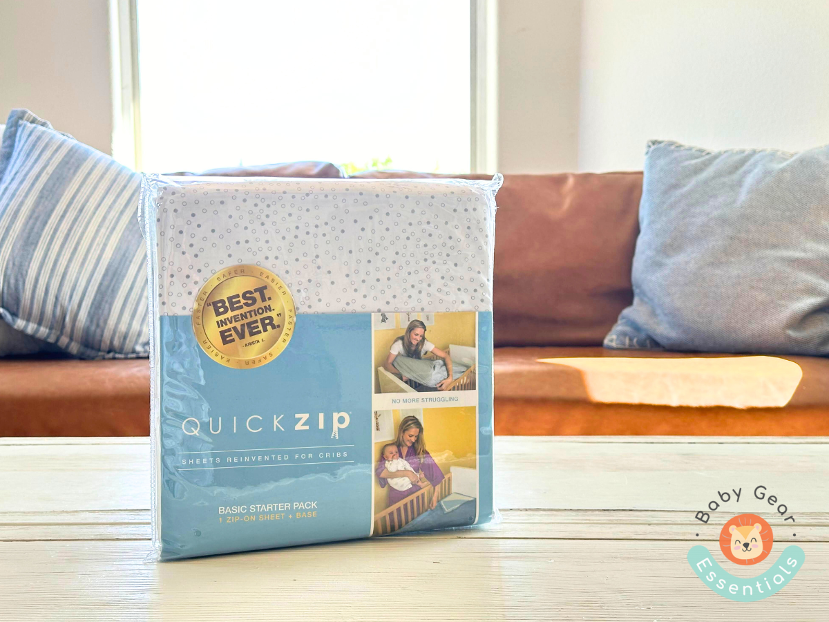 QuickZip Crib Sheet Set in the package on a table