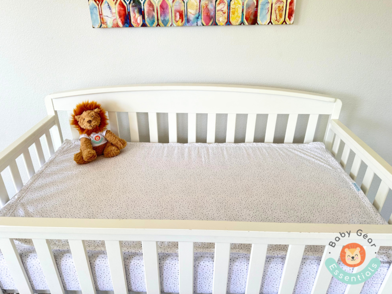 QuickZip Crib Sheet Set on a crib with Baby Gear Essentials lion